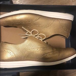 Gold Cole Haan Oxford tennis shoes